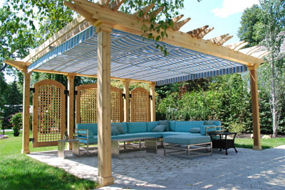 Pergola with Blue Canopy Over Sectional Sofa